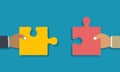 Teamwork or collaboration concept. Two hands holding jigsaw puzzle pieces to put them together Royalty Free Stock Photo